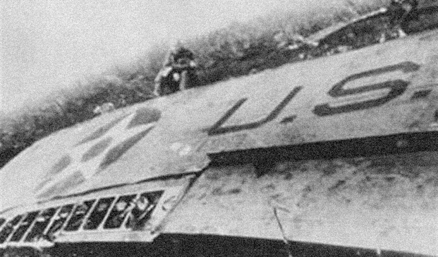 A despondent Jimmy Doolittle sits by the wreckage of his B-25 somewhere in China